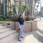 Cool summer day in Long Beach classic cut jeans and sweater